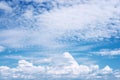 White Clouds as Clear Bright Blue Sky Background