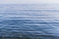 Clear calm blue water surface of lake baikal, ripples, morning, light summer Royalty Free Stock Photo