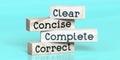 Clear, concise, complete, correct - words on wooden blocks