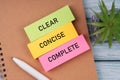 Clear, concise and complete text on colorful paper note Royalty Free Stock Photo