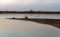 Clear dawn sky over calm estuary water