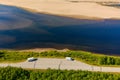 Aerial view of river Karasjohka, sandy beach and campers at the border of Finland and Norway