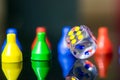 A clear dice and tokens in a reflective surface Royalty Free Stock Photo