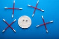 Clear disk ear sticks blue background Royalty Free Stock Photo