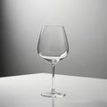 Clear, empty wine glass, with a classic stem and rounded bowl, is Royalty Free Stock Photo