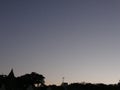 Clear evening summer sky graded from light orange to near inky blue/black