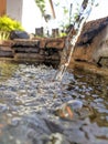 A clear fountain falling into a pool of water Royalty Free Stock Photo