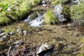 Clear fresh mountain water over stones