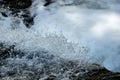 Clear, fresh stream of water splattering in a natural creek. Environmental, water conservation concept. Royalty Free Stock Photo