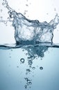 Clear fresh water splashes upwards from surface. Many small, large bubbles rise from below water level. Liquid shows dynamic Royalty Free Stock Photo