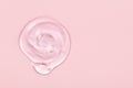 Clear gel drop or smear isolated on pink background Royalty Free Stock Photo