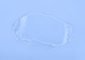 Clear gel smear isolated on blue background. Top view Royalty Free Stock Photo