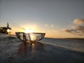 Clear glass ashtrays and very beautiful sunrise