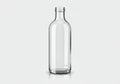 Clear glass bottle with cylindrical shape and a short neck. It Royalty Free Stock Photo