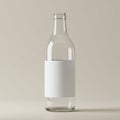 Clear glass bottle with a simple cylindrical shape, featuring a blank white rectangular Royalty Free Stock Photo