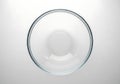 Clear Glass Bowl on White Background with Reflection and Soft Lighting Royalty Free Stock Photo