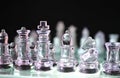 Clear Glass Chess Set on dark background Royalty Free Stock Photo