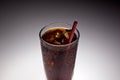 Clear glass with ice and soda with red straw Royalty Free Stock Photo