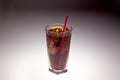Clear glass with ice and soda with red straw Royalty Free Stock Photo
