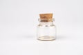 Clear glass jar with amber liquid, stoppered placed on a plain surface under soft light Minimalistic style. m Royalty Free Stock Photo