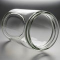 Clear glass jar lying on its side with a smooth surface and cylindrical shape Royalty Free Stock Photo