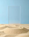 Clear Glass Rectangle on Sandy Beach Against Blue Sky Royalty Free Stock Photo