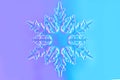 Clear glass snowflake in neon light