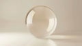 A clear glass sphere resting on a reflective surface in soft light Royalty Free Stock Photo
