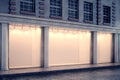 Clear glass storefront at night side