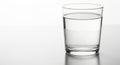 Clear glass of water on reflective surface Royalty Free Stock Photo