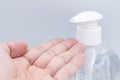 Clear hand sanitizer in a clear pump bottle isolated on a white background