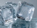 Detailed frozen ice cubes covered with tiny water bubbles creating a refreshing and cool effect on a smooth surface in natural Royalty Free Stock Photo