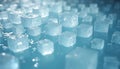 Clear ice cubes float in cool blue water. Small droplets and bubbles form around the cubes. Refreshing scene suggests cold drinks Royalty Free Stock Photo