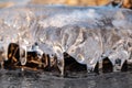 Clear ice icicle close-up sparkling on frozen lake Royalty Free Stock Photo