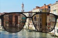 Clear image in glasses against blurry landscape