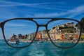 Clear image in glasses against blurry landscape