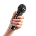 A hand holding a black microphone against a white background in a studio setting for audio recording Royalty Free Stock Photo