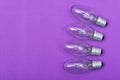 Clear Incandescent Night Light Bulbs with candelabra base on purple