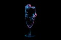 Liquid splashing and hugging glass under blue and red lights isolated on a black background Royalty Free Stock Photo