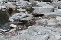 The clear Maggia River flowing along the Stones in the Maggia Valley in the Ticino in Switzerland