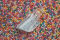 Clear mystical faceted crystal of quartz chalcedony on a multicolored background close-up. Wonderful mineral