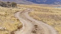 Clear Panorama Dirt road with a stunning view of mountain and blue sky in the distance