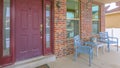 Clear Panorama Facade of a home with a red front door and reflective sidelights and windows Royalty Free Stock Photo