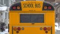 Clear Panorama Yellow school bus with rectangular window and several signal lights at the rear