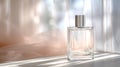 A clear perfume flacon sits on a mirror, capturing gentle sunlight in a serene setting Royalty Free Stock Photo