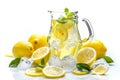 A clear pitcher filled with lemonade, ice cubes, and slices of fresh lemons, with some green leaves and mint herbs. Isolated on Royalty Free Stock Photo