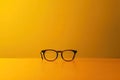 Clear Pixel Visual of a Yellow Table with a Yellow Table That Has a Pair of Glasses on it Royalty Free Stock Photo