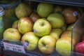 A clear plastic bin filled with apples in the market in Atlanta Georgia