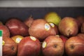 A clear plastic bin filled with Red D\'Anjou Pears in the market in Atlanta Georgia