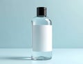 Clear plastic bottle with black cap has white blank label. Ready for product placement or brand customisation. Use for liquid Royalty Free Stock Photo